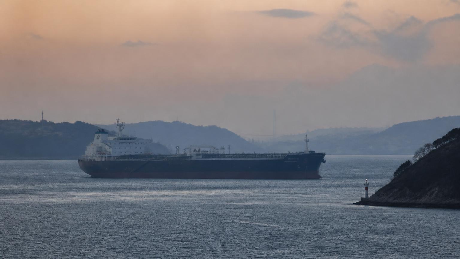 Inland waterway logistics infrastructure with oil barges and coastal storage tanks